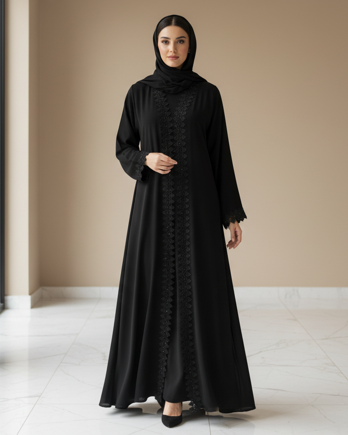 Woman wearing a black abaya in a minimalistic setting